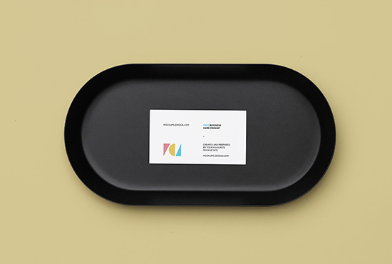 Business card on a black plate mockup
