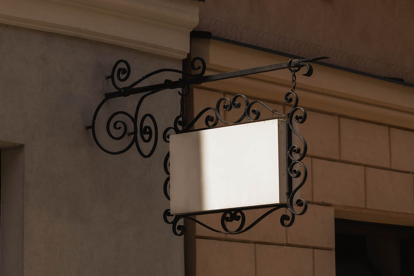 Ornate hanging wrought iron signboard mockup